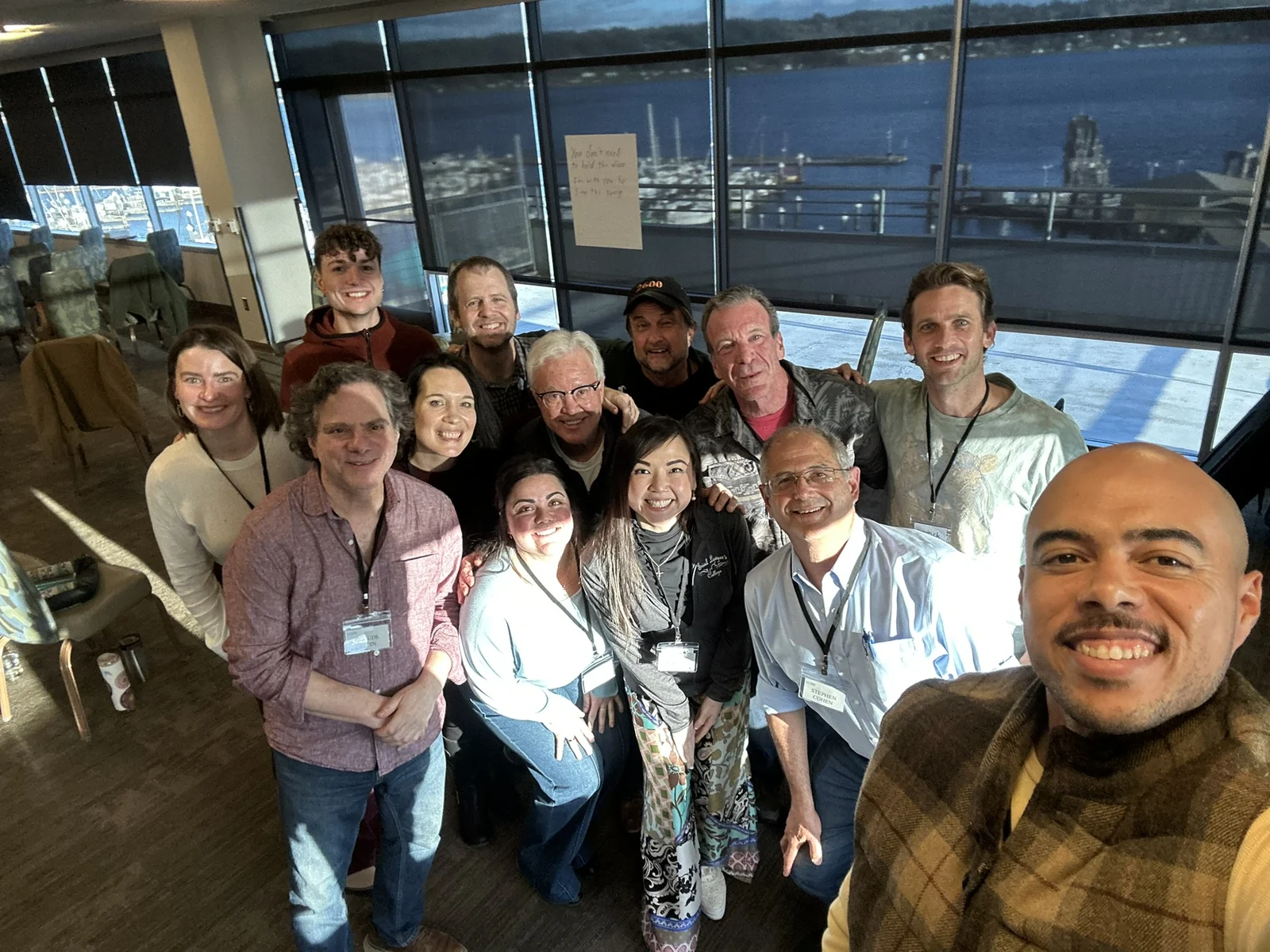 A group gathered in an Ethos classroom overlooking the water
