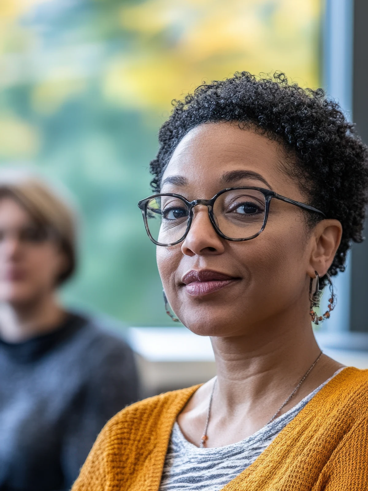 A participant listening during a group learning session